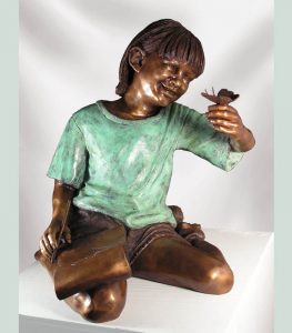 Bronze statue of little girl holding a butterfly