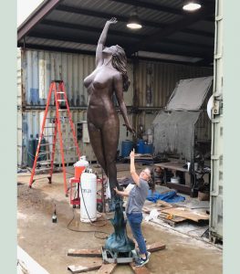 Eve sculpture in Texas, with artist Bridgette Mongeon