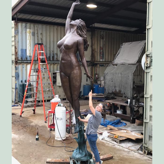 Eve sculpture in Texas, with artist Bridgette Mongeon